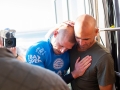 Mick Fanning and Kelly Slater embrace.